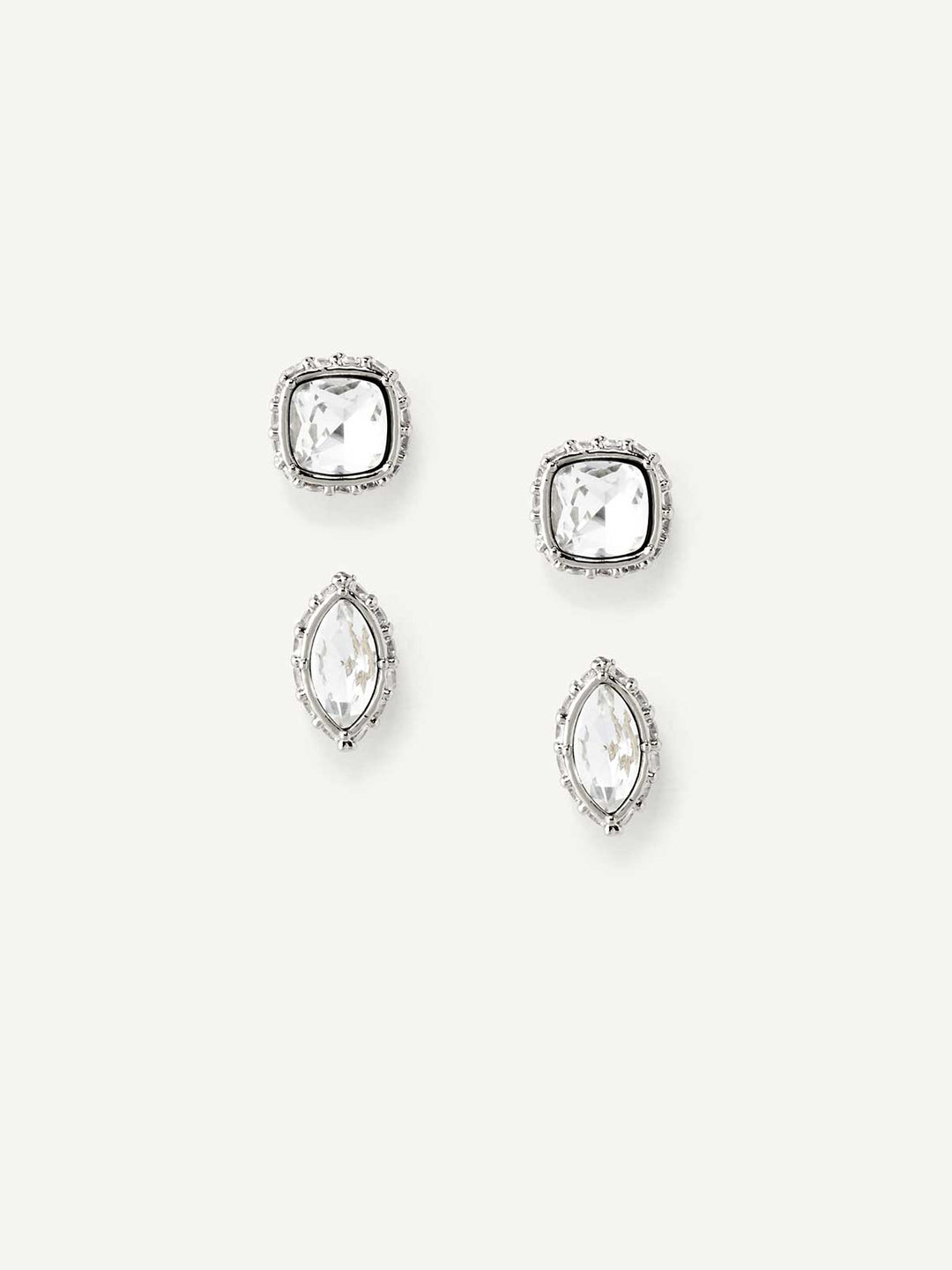 Set of silver crystal stud earrings on a white background